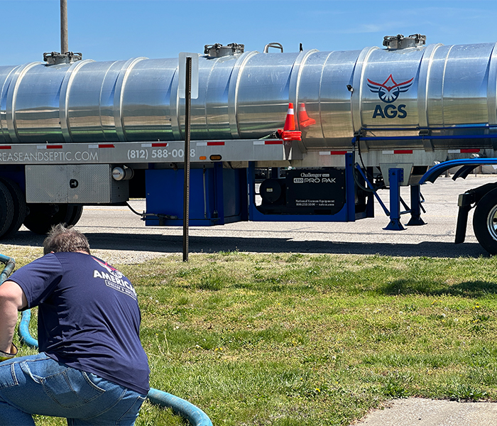 AGS commercial pump truck with man and hose