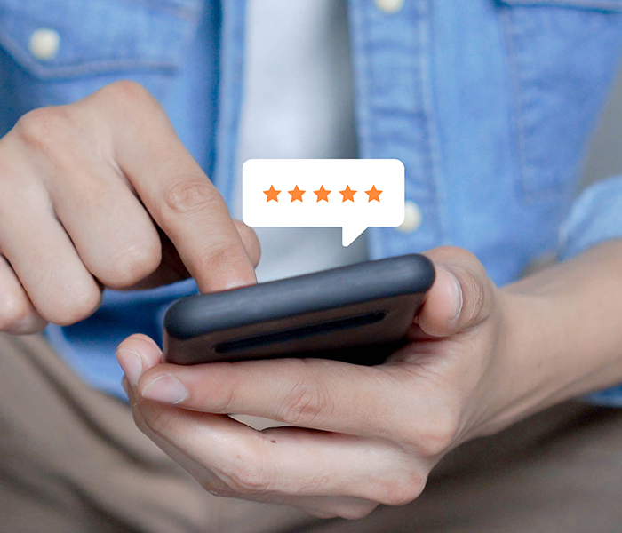 man giving customer satisfaction rating on his mobile device