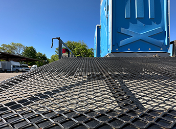 artisitc view of field trailer with porta potties